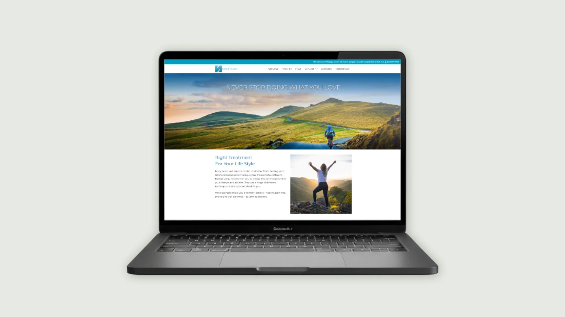 A laptop showing Spine and therapy website page